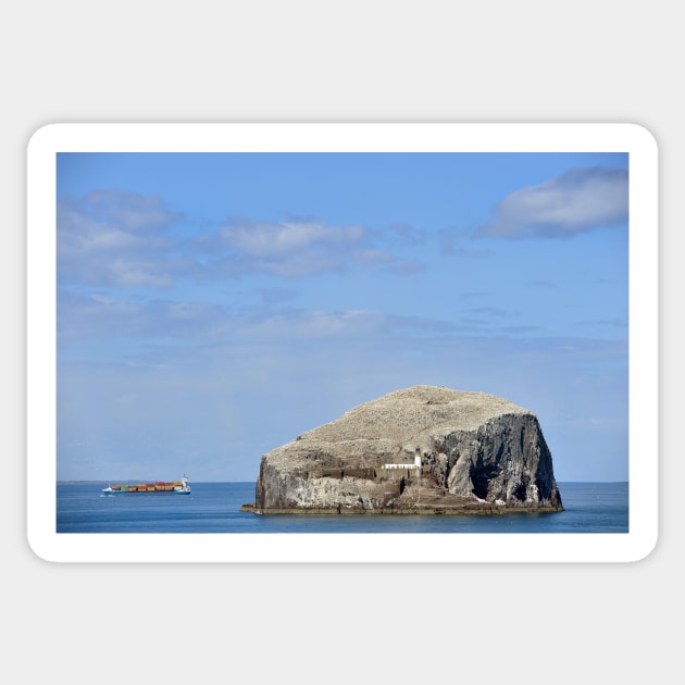 A cargo ship passes Bass Rock, Scotland Sticker by richflintphoto